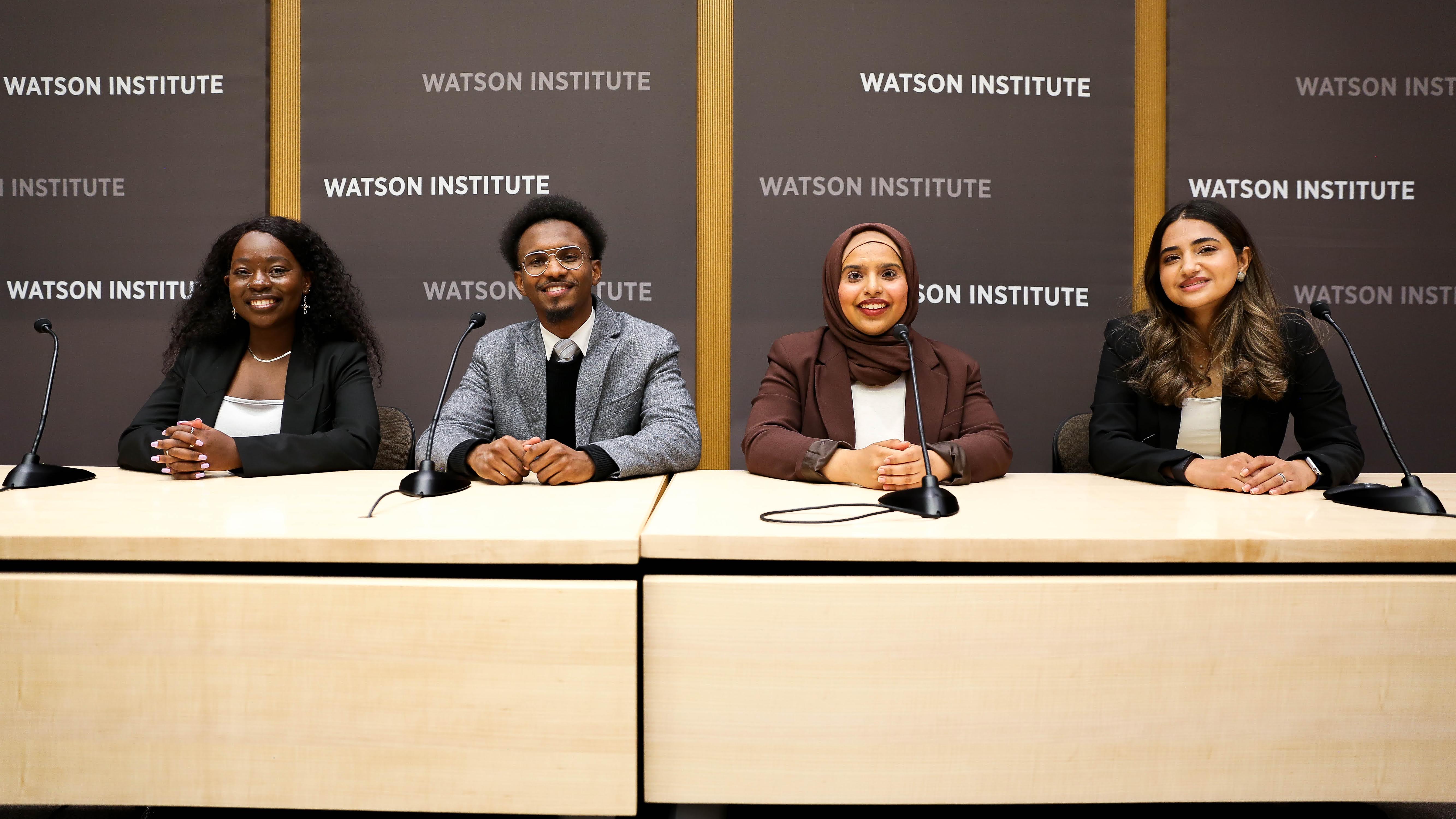 students sitting on a panel at the watson institute